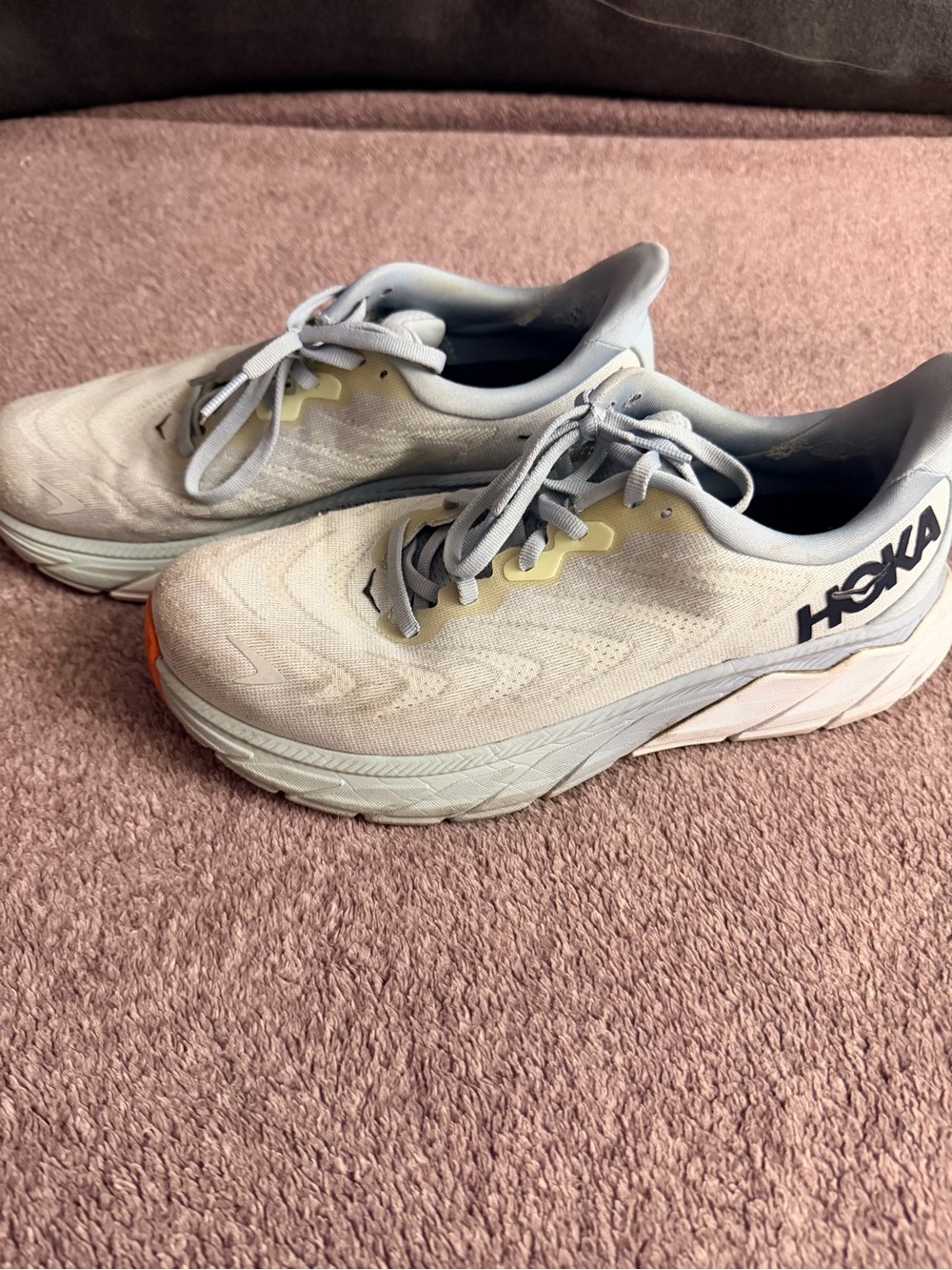 Hoka light gray and yellow running shoes